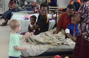 Simeon handing out a lolli